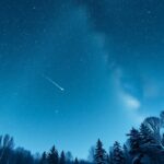 Téli égbolt csillagokkal és meteorral egy csendes éjszakán.