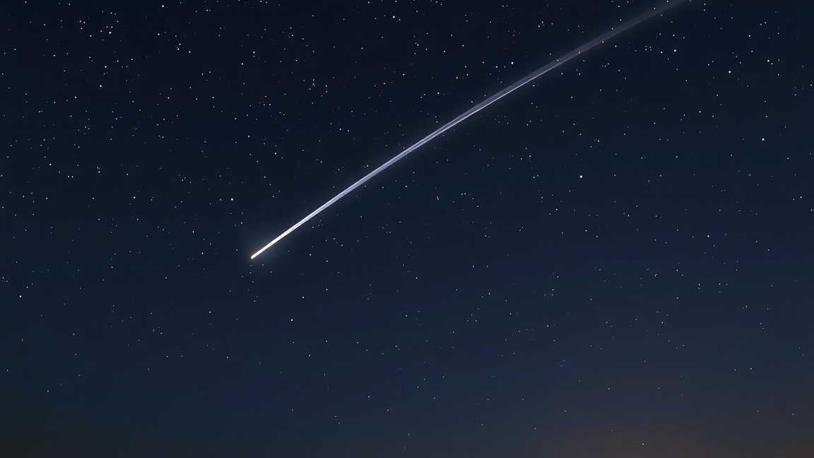 Quadrantid meteor shower streaking across a starry night sky.