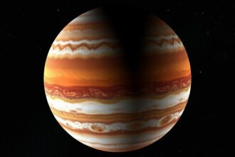 A Jupiter bolygó látványa, a sávos atmoszférájával és árnyékos oldalával.